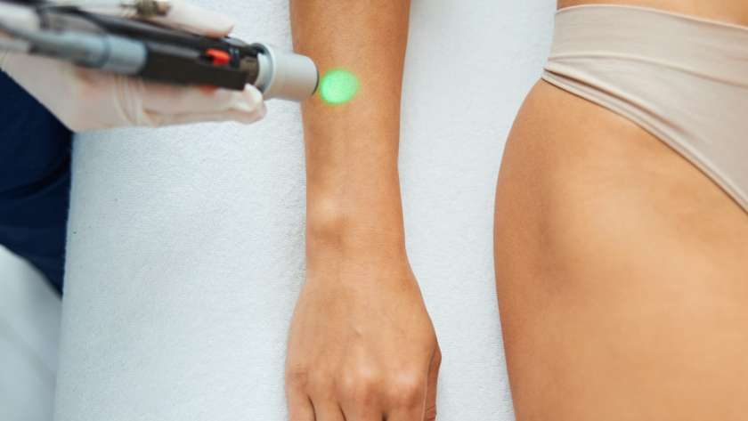 Woman undergoing a laser epilation in a beauty parlor