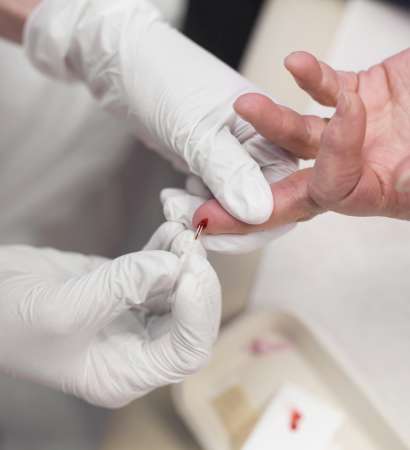 Doctor taking blood sample